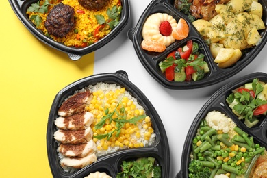 Lunchboxes with different meals on color table, flat lay. Healthy food delivery