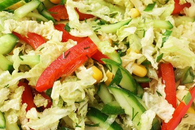 Delicious salad with Chinese cabbage, cucumber and bell pepper as background, top view