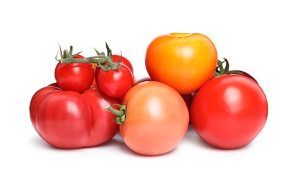 Many different ripe tomatoes on white background