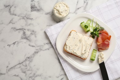 Photo of Delicious sandwich with cream cheese, cucumber and jamon on white marble table, flat lay. Space for text