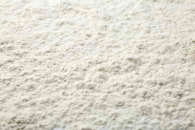 Pile of organic flour as background, closeup