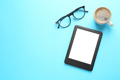 Modern e-book reader, glasses and coffee on turquoise background, flat lay. Space for text