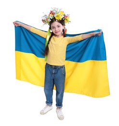 Little girl in flower wreath with flag of Ukraine on white background