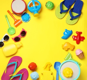Flat lay composition with beach toys on color background. Space for text