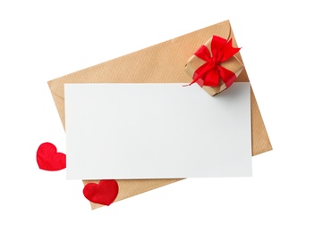 Blank card, envelope and gift box on white background, top view. Valentine's Day celebration