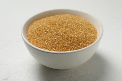 Brown sugar in bowl on white table
