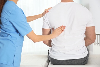 Doctor working with patient in hospital, closeup. Rehabilitation massage