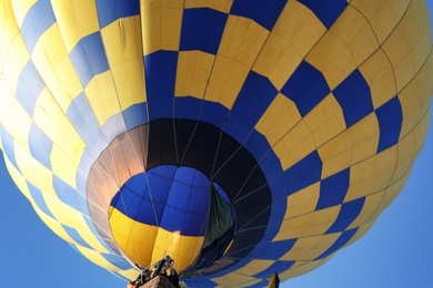 Beautiful view of hot air balloon in blue sky, closeup