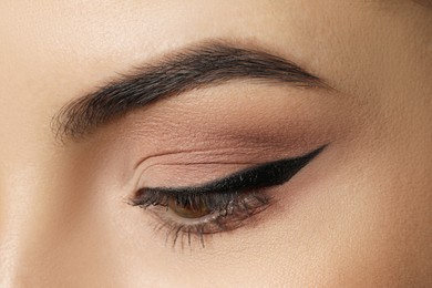 Photo of Young woman with beautiful eyebrows, closeup view