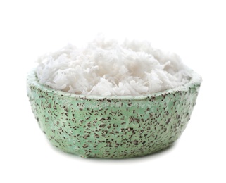 Fresh coconut flakes in bowl on white background