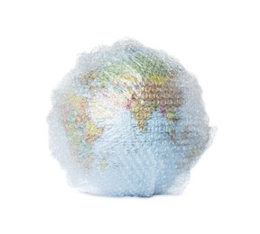 Photo of Globe packed in bubble wrap isolated on white. Environmental conservation