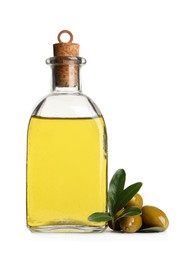 Glass bottle of oil, ripe olives and green leaves on white background