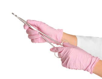 Doctor in sterile gloves with medical forceps on white background