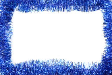 Frame of shiny blue tinsel on white background, top view. Space for text