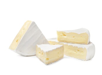 Tasty cut brie cheese on white background