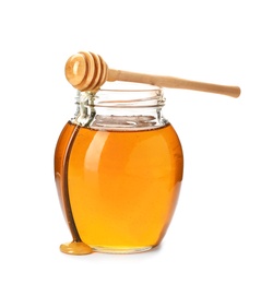 Jar with delicious honey and dipper on white background