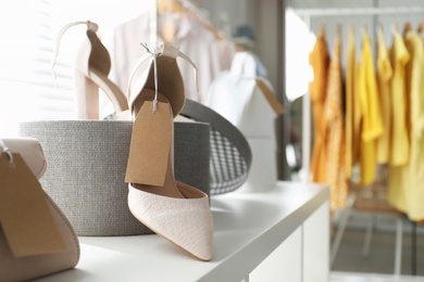 Photo of Women's high heel shoes in modern clothing boutique, space for text