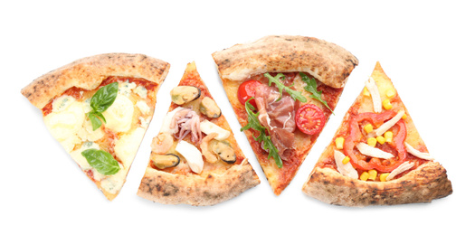 Slices of different delicious pizzas on white background, top view