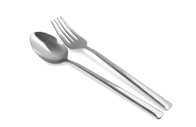 New shiny fork and spoon on white background