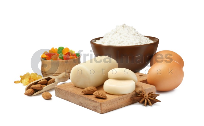 Marzipan and other ingredients for homemade Stollen on white background. Baking traditional German Christmas bread
