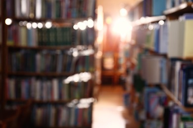 Blurred view of different books on shelves in library