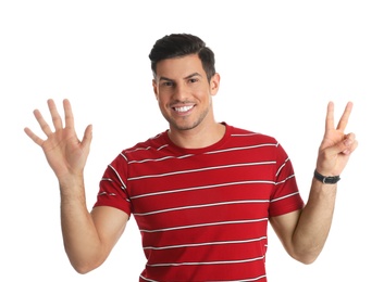 Man showing number seven with his hands on white background