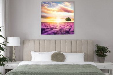 Canvas with printed photo of beautiful lavender field at sunset on beige wall in bedroom