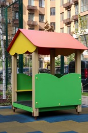 Colourful house for children on outdoor playground in residential area
