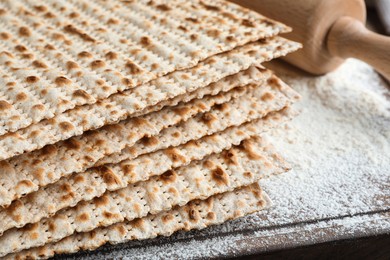 Stack of matzos on wooden board, closeup