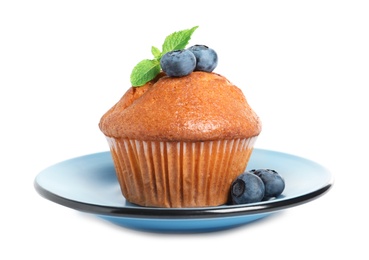 Photo of Plate with tasty muffin and blueberries on white background
