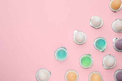 Tasty bright jelly cups on pink background, flat lay. Space for text