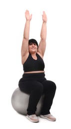 Photo of Happy overweight mature woman sitting on fitness ball against white background