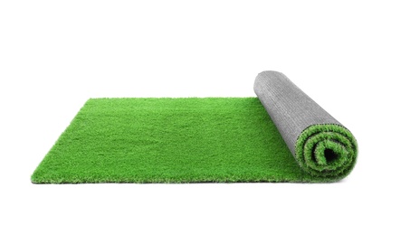 Photo of Rolled artificial grass carpet on white background. Exterior element