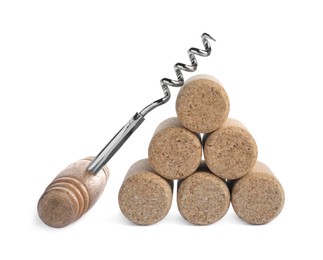 Photo of Corkscrew and stacked wine corks on isolated background