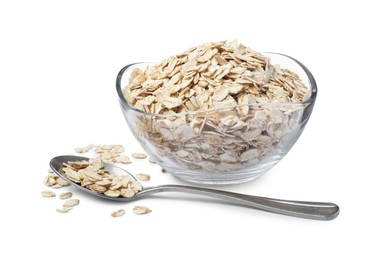 Raw oatmeal, glass bowl and spoon on white background