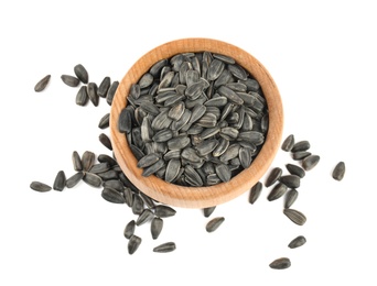 Photo of Sunflower seeds in bowl on white background, top view