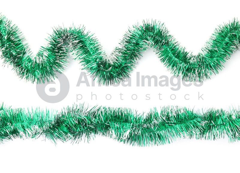 Shiny green tinsels on white background, collage. Christmas decoration