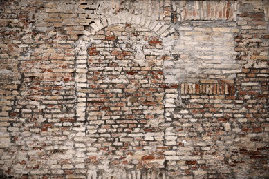 Old brick wall with blocked doorway as background