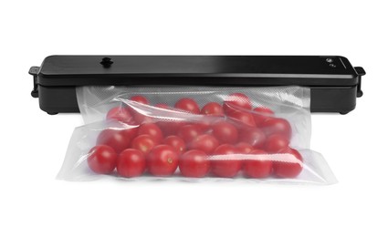 Sealer for vacuum packing with plastic bag of cherry tomatoes on white background
