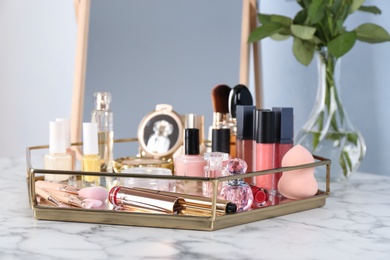 Tray with set of luxury cosmetics on dressing table