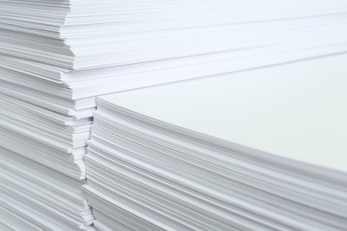 Photo of Stacks of white paper sheets, closeup view