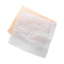 Photo of Sheets of crumpled baking paper on white background, top view