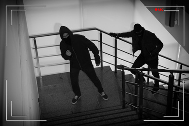 Image of Criminals in masks on stairs indoors, view through CCTV camera