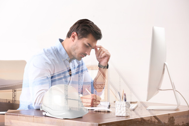 Image of Engineer working with computer at table in office and pedestrian bridge. Double exposure