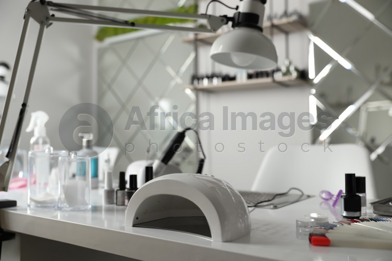 Professional equipment for manicure on table in beauty salon