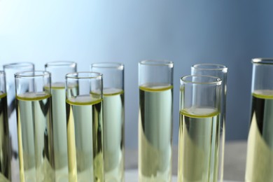 Test tubes with urine samples for analysis in laboratory, closeup