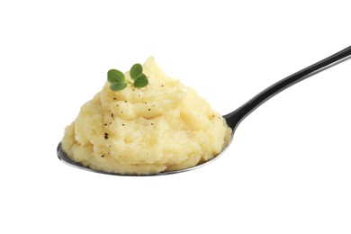 Spoon of tasty mashed potatoes with microgreen and black pepper isolated on white