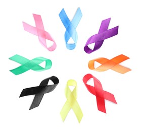 Image of Collection of different color ribbons on white background, top view. World Cancer Day