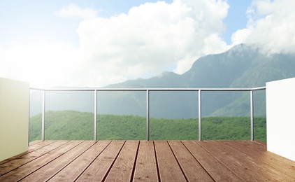 Image of Outdoor wooden terrace revealing picturesque view on mountains in morning