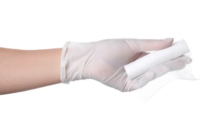 Doctor holding gauze bandage roll on white background, closeup